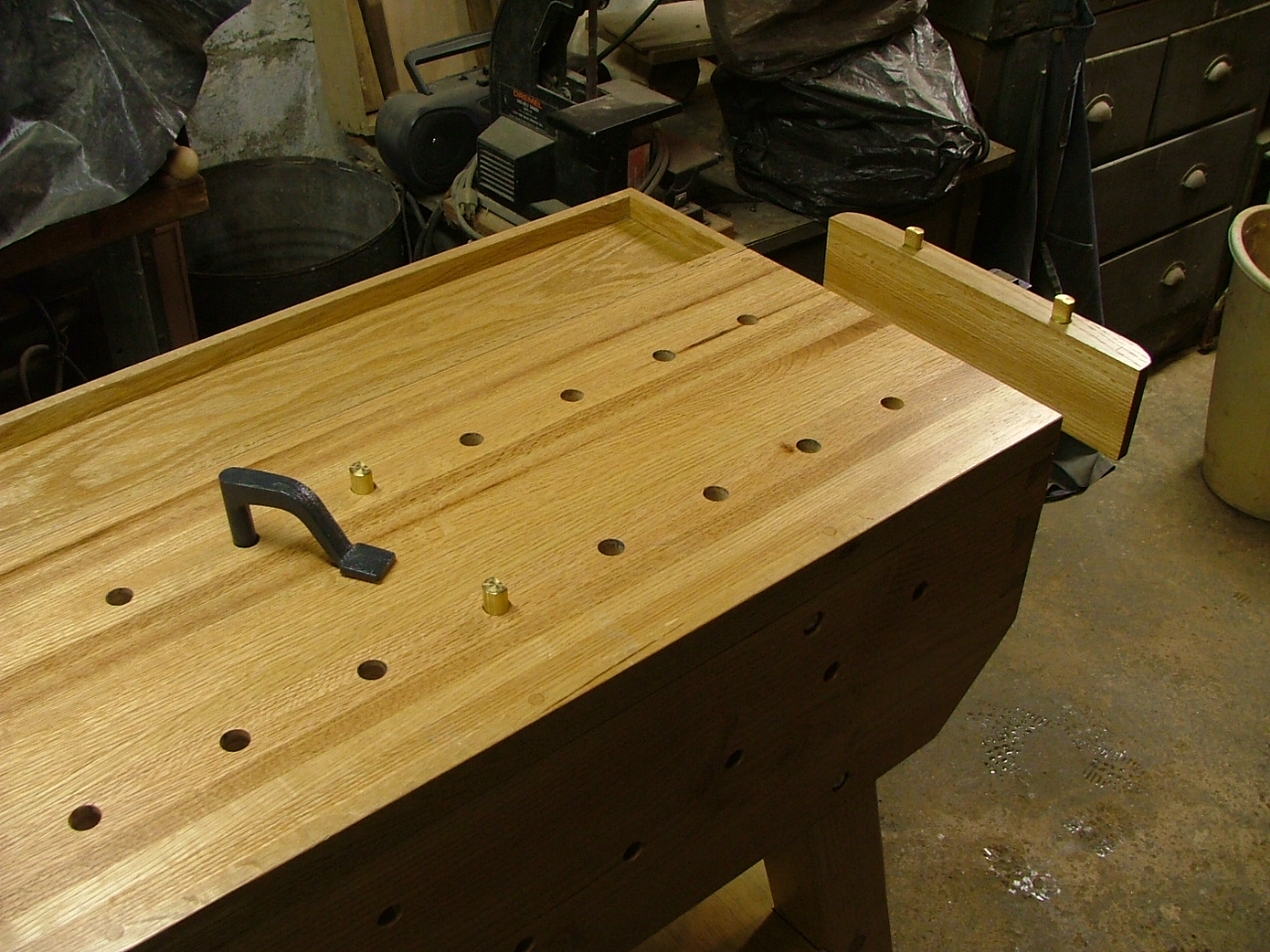 Woodworking workbench dog holes
